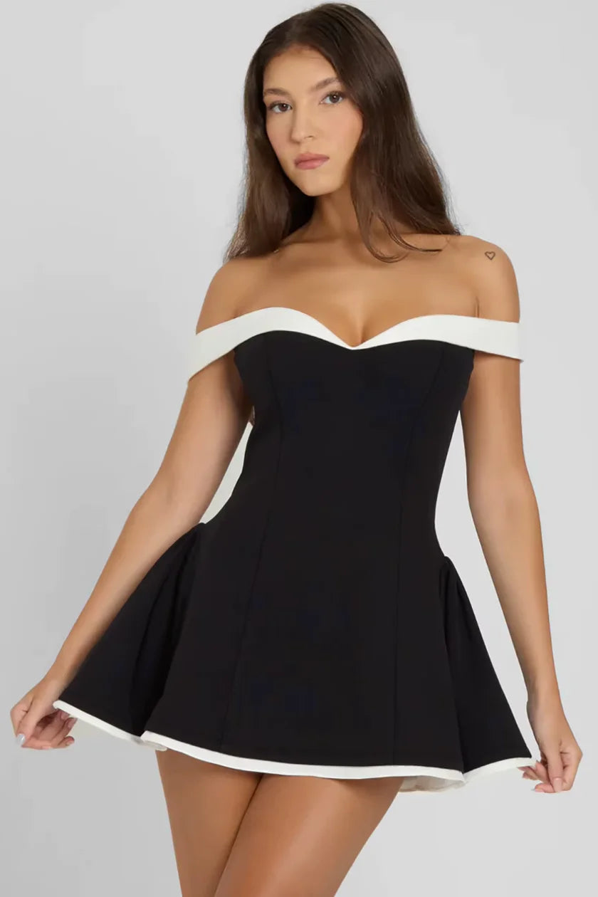 Black flared dress with white trim, made of premium cotton blend. Timeless design with flattering silhouette, perfect for…