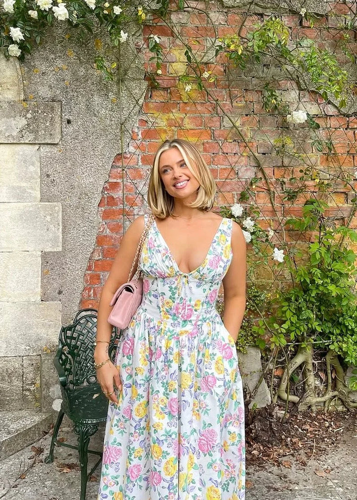Floral midi dress with v-neckline featuring a delicate floral pattern on a soft, flowy fabric perfect for everyday wear.