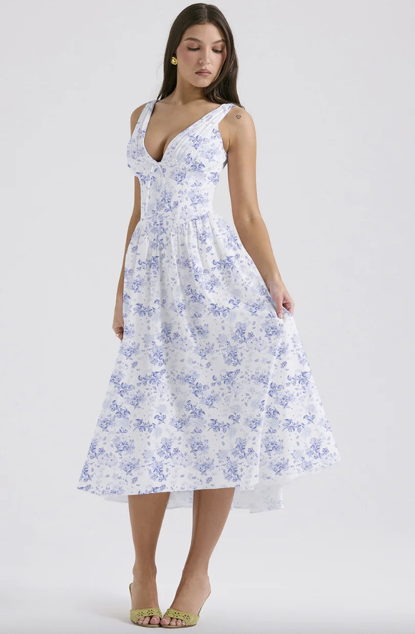 "Blue floral midi dress with v-neckline made of lightweight fabric, perfect for a casual or semi-formal look."