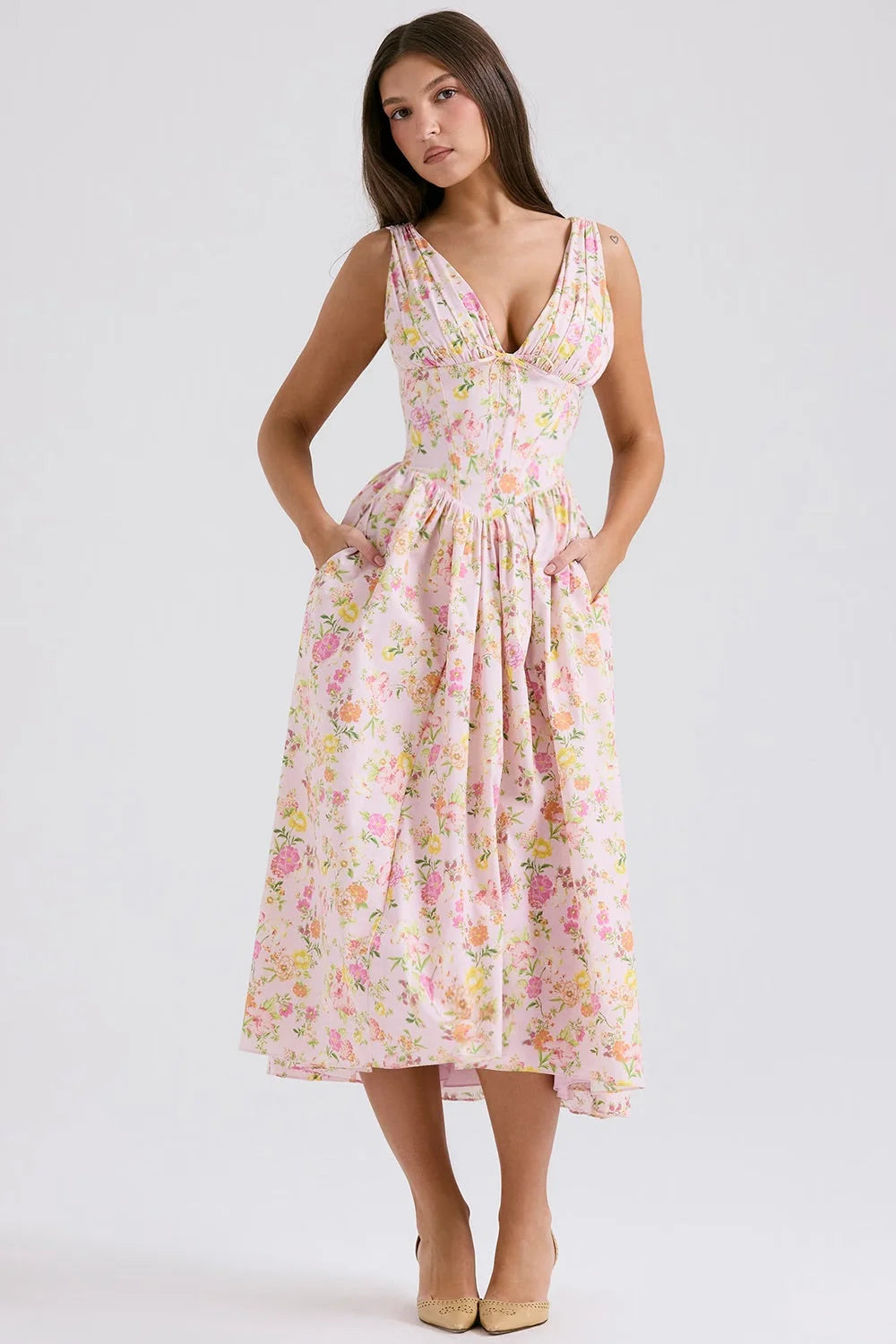 Pink floral midi dress with v-neckline by Kamara. Features a lightweight and flowy fabric perfect for a casual yet chic look.