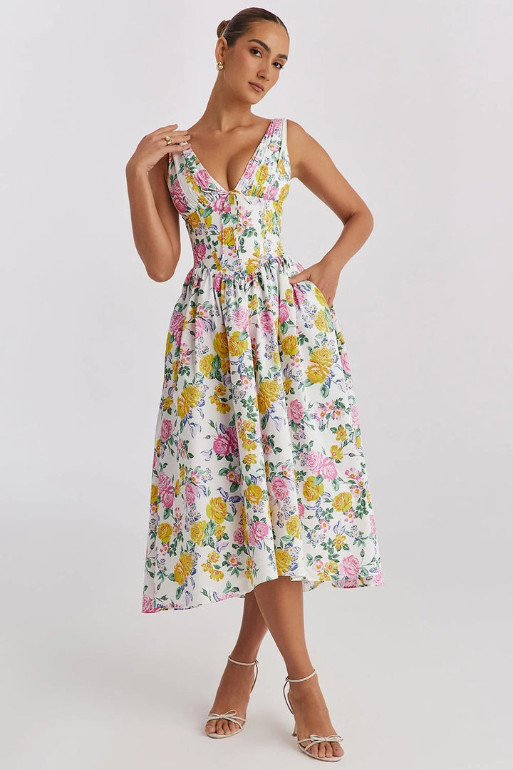 Yellow floral midi dress with v-neckline, perfect for a sunny day. Made of light, breathable fabric, ideal for a casual yet…