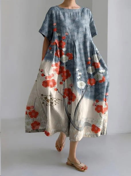 "Kami relaxed-fit dress in Colorful Flowers featuring a vibrant flower pattern design, made from soft and breathable fabric."