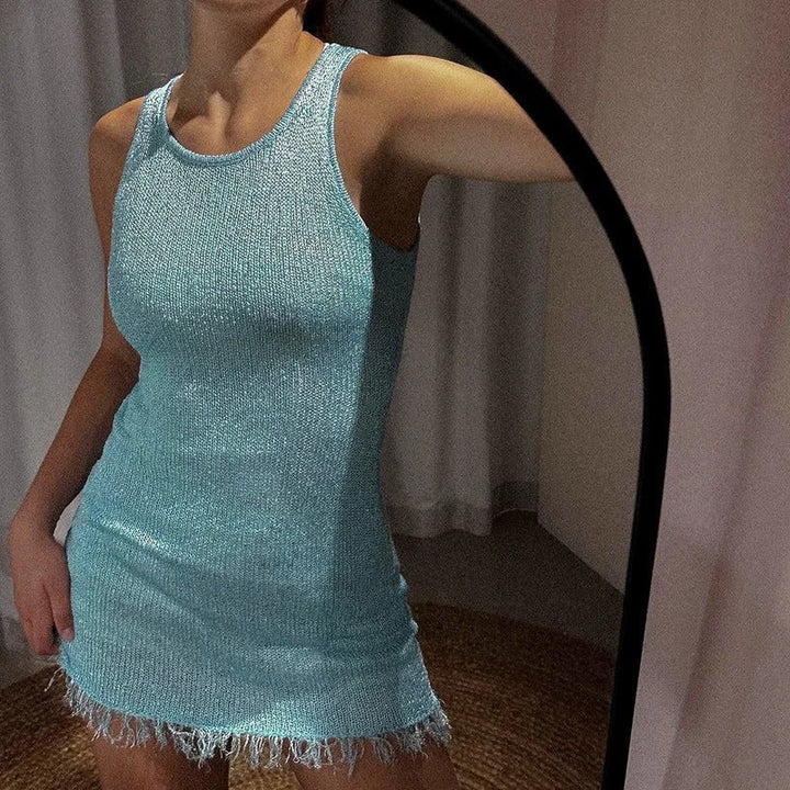"Sleeveless mini dress with sparkly finish in black, perfect for a night out."