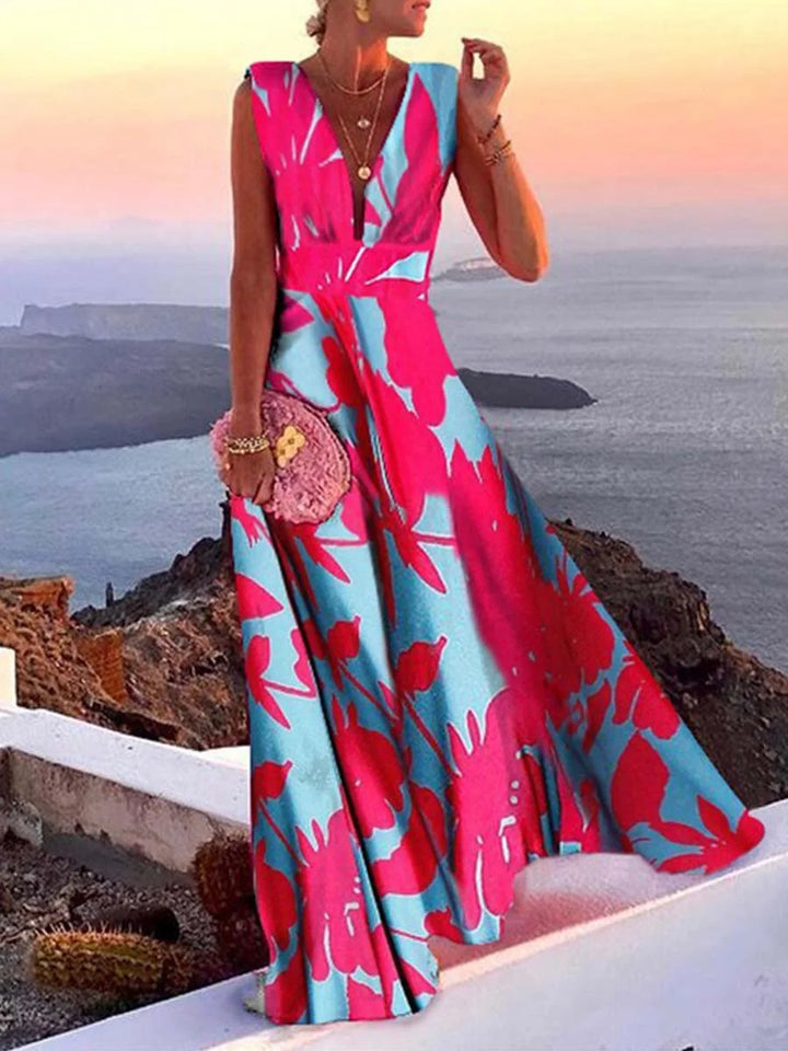 Sleeveless dress in Lichtblauw en roze with V-neckline, perfect for summer. Made from lightweight and breathable fabric.
