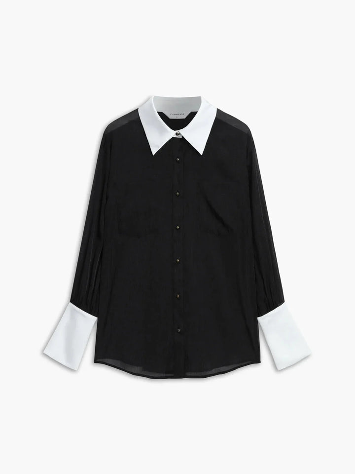 Black sheer button-up blouse with chic collar, feminine design. Made from delicate fabric perfect for formal or casual wear.