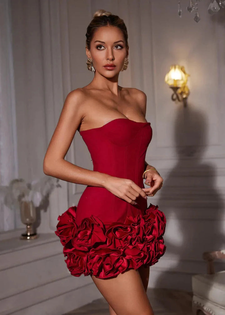Strapless red dress with rosette detail, perfect for elegant events.