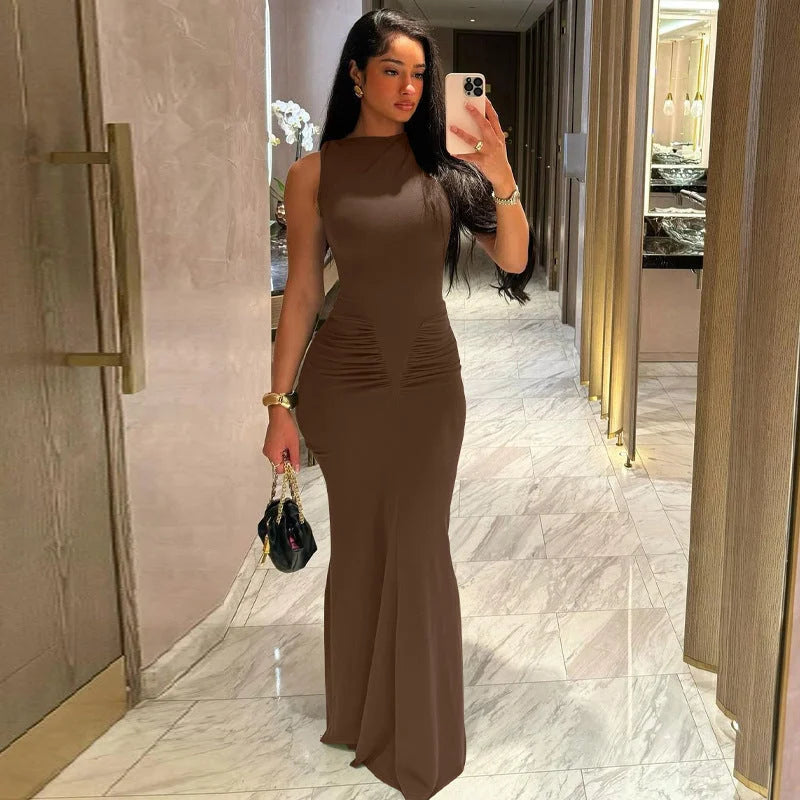"Sleeveless fitted maxi dress with pleats in a soft, flowy fabric for a flattering look."