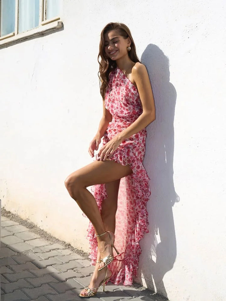 Red floral high-low dress with a flowing silhouette, featuring a vibrant floral print on lightweight, breathable fabric.