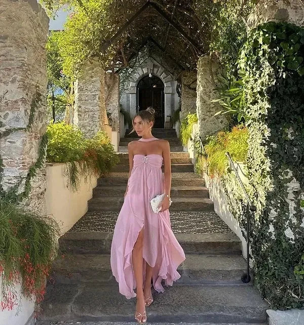 Strapless dress with elegant ruffles in sleek silk fabric, perfect for formal occasions and evening events.