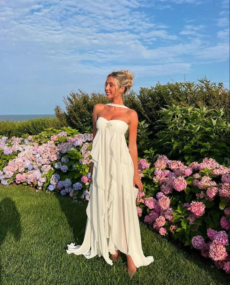 Strapless dress with elegant ruffles in black satin fabric perfect for special occasions.