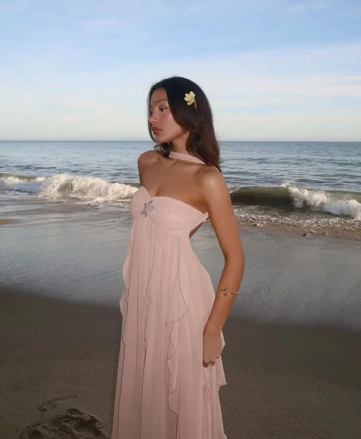 Pink strapless dress with delicate ruffles, perfect for a special occasion. Made from soft and flowy fabric, exudes elegance…
