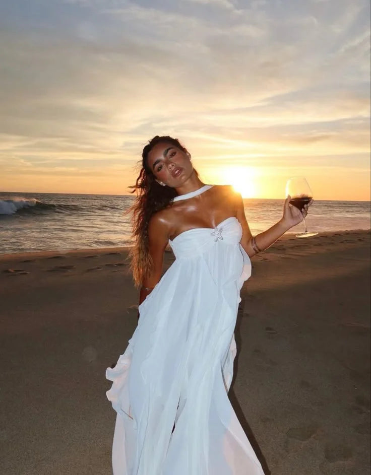 White strapless dress with elegant ruffles, perfect for special occasions. Made of high-quality fabric with a flattering…