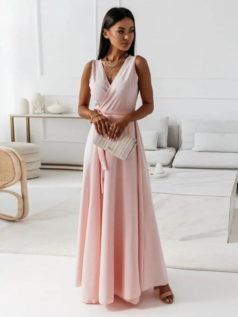 Light Pink sleeveless maxi dress with V-neck and pleated design. Made of breathable, flowy fabric ideal for summer outings.