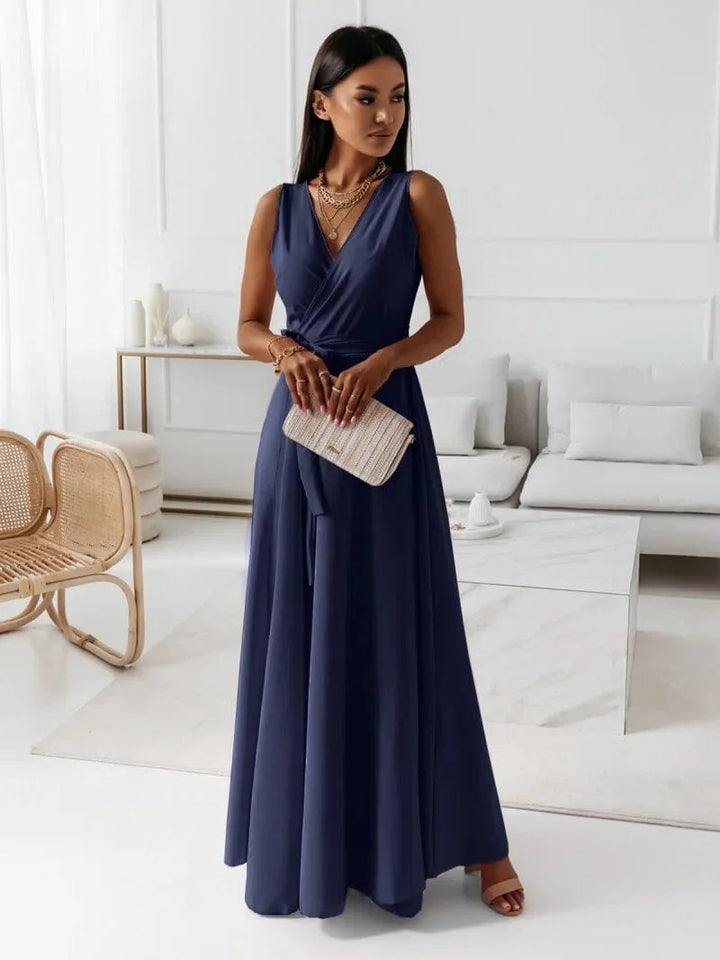 "Navy Blue sleeveless V-neck pleated maxi dress by Katarina, crafted with lightweight flowing fabric for a flattering and…