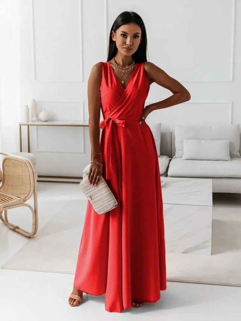 Red sleeveless V-neck pleated maxi dress made from flowing fabric, perfect for a chic and elegant look.