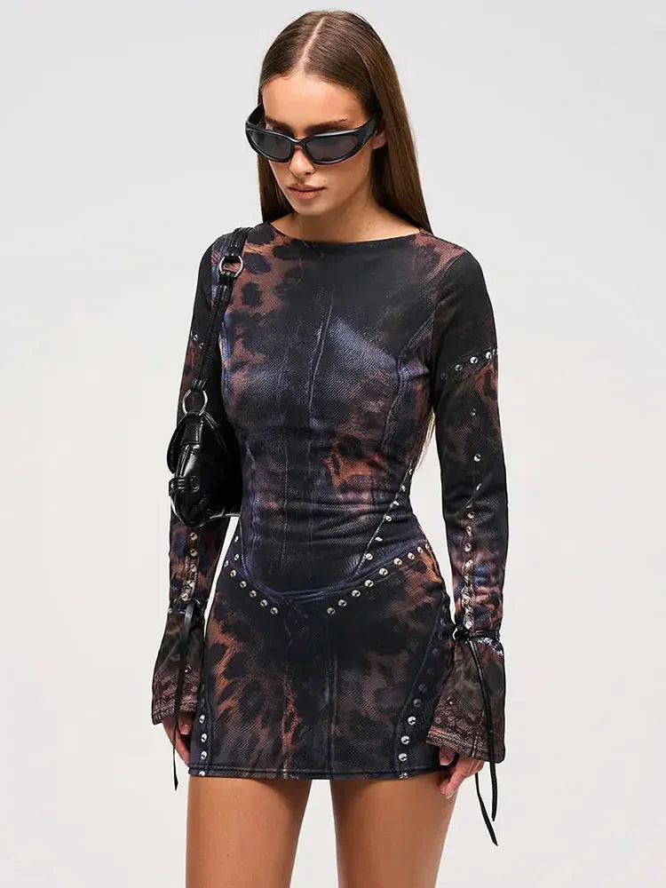 Black abstract print mini dress with studs; made from comfortable stretch fabric, featuring unique stud details.