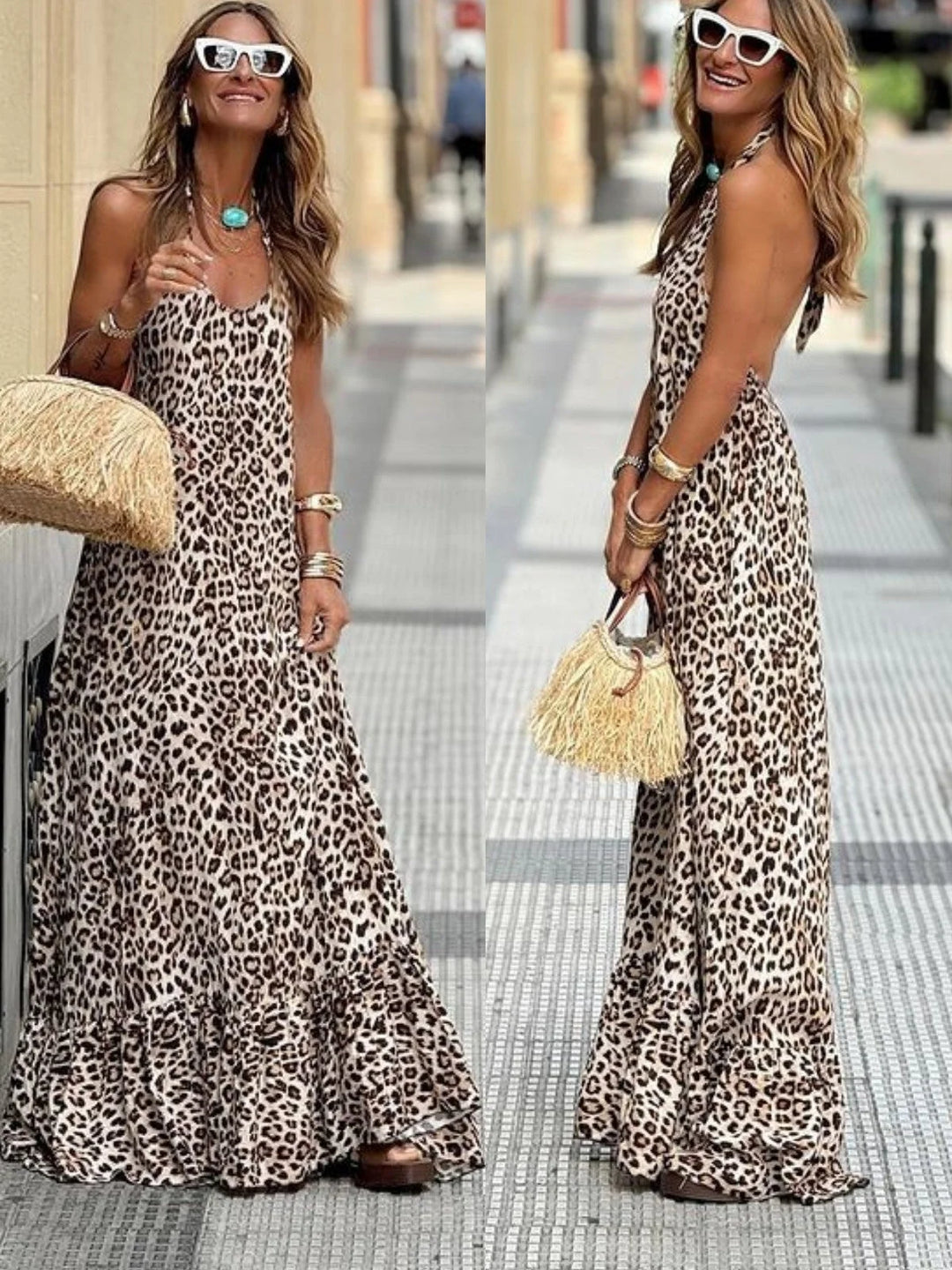 Sleeveless leopard print maxi dress featuring a flowy silhouette and bold animal print pattern, perfect for a chic and…