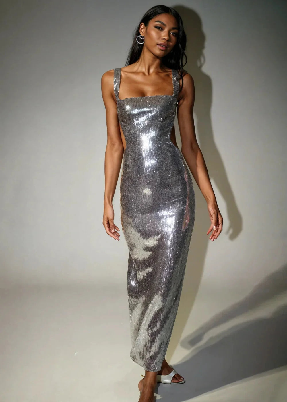Sleeveless metallic silver sequin dress showcasing a shimmering design perfect for a glamorous evening look in Silver.