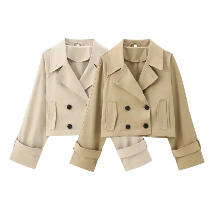 Stylish cropped trenchcoat in neutral color with button detailing, made from durable cotton blend fabric.