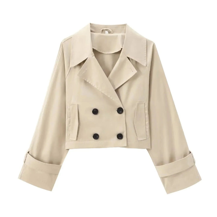 Light beige cropped trenchcoat with button detailing, a modern twist on a classic style perfect for versatile styling.
