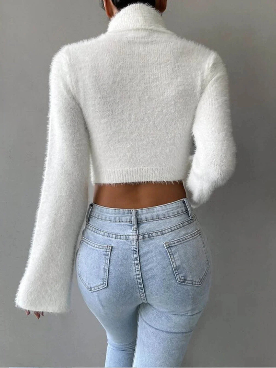 "White cropped turtleneck sweater with fluffy texture, perfect for winter layering"