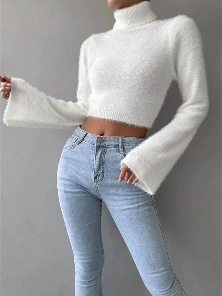 White fluffy cropped turtleneck sweater, perfect for cozy days. Soft and warm, pairs well with jeans or skirts for a trendy…