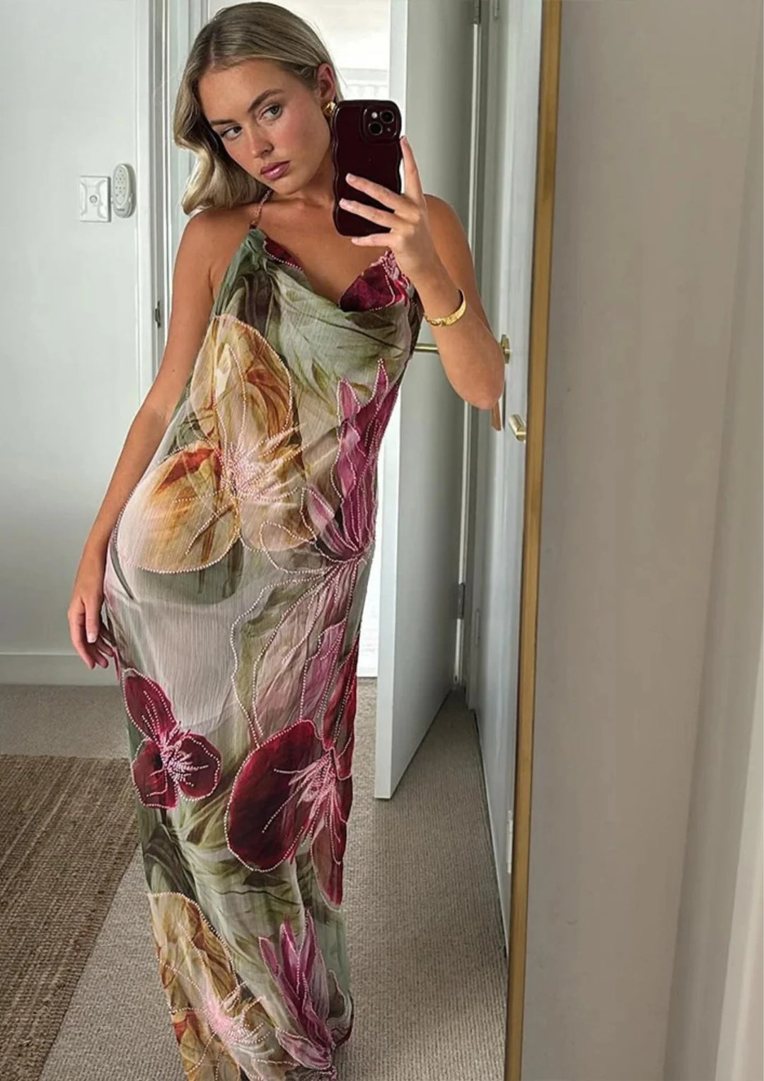 "Sleeveless knee-length dress in Kenya featuring a vibrant floral design on a lightweight fabric, perfect for warm weather."
