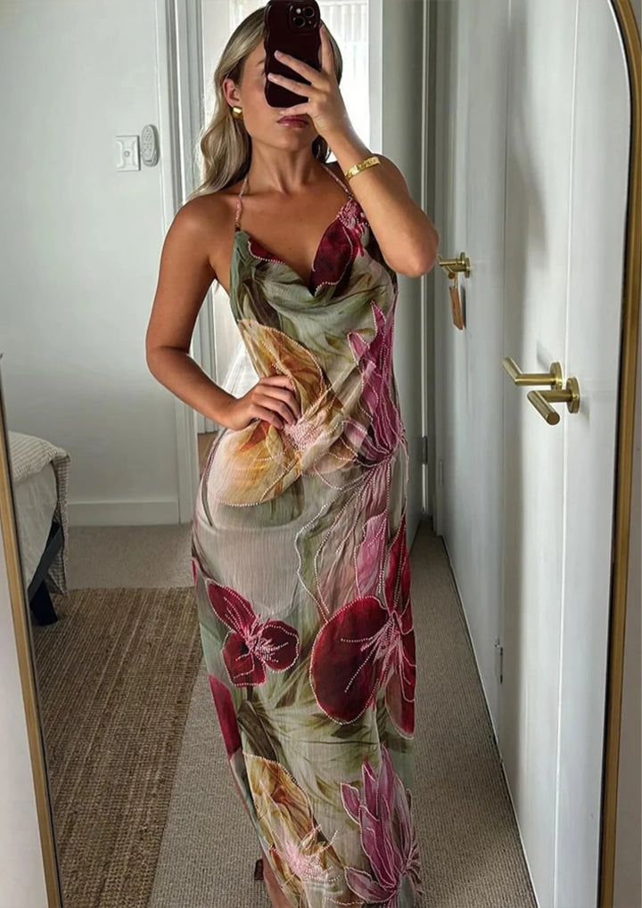 Sleeveless dress from Kenya with vibrant floral design, perfect for summer days.