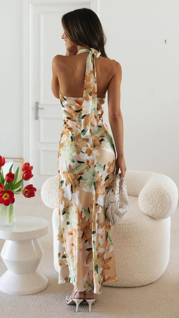 "Keylin halter maxi dress featuring a floral pattern, perfect for a breezy sunny day out."