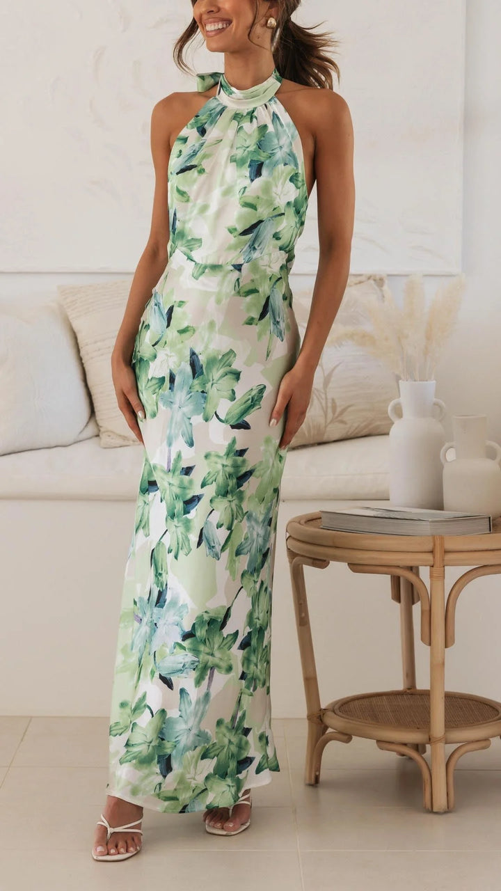 Floral patterned halter maxi dress featuring a vibrant design on soft, flowing fabric for a stylish and comfortable look.