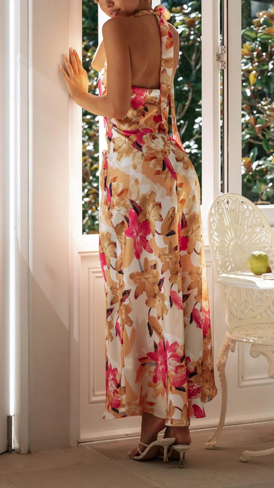 Floral patterned halter maxi dress with a flowy silhouette, perfect for sunny days. Made of lightweight and breathable…