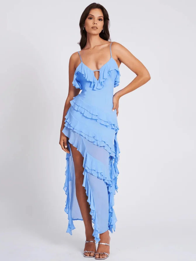 Asymmetrical blue maxi dress with ruffles, ideal for casual events, features a flowy silhouette and a vibrant blue color.