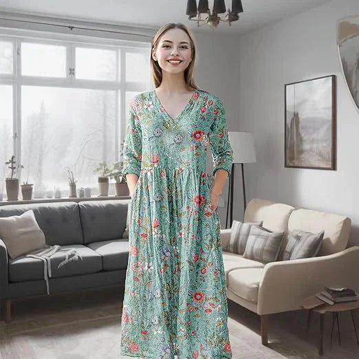 Teal floral maxi dress with long sleeves in a flowy and comfortable fabric, perfect for a casual summer day out.