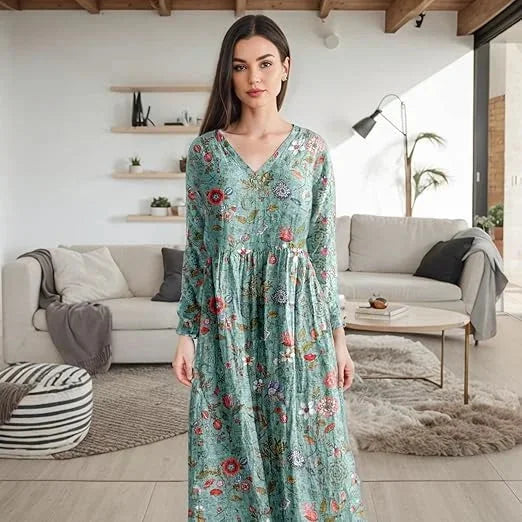 "Teal floral maxi dress with long sleeves made of soft and flowy fabric, perfect for casual outings and everyday wear."