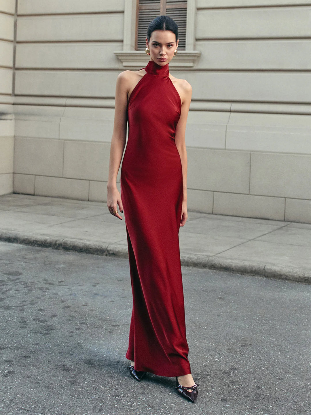 Burgundy satin halter dress with trailing bow, a stunning choice for an elegant evening look.