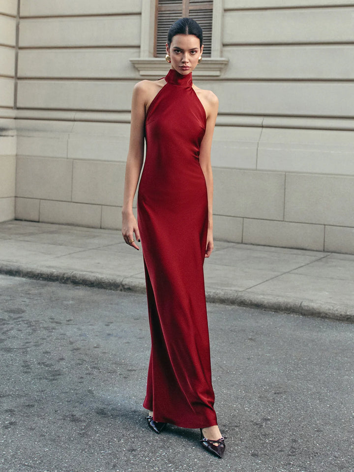 Burgundy satin halter dress with trailing bow, a stunning choice for an elegant evening look.