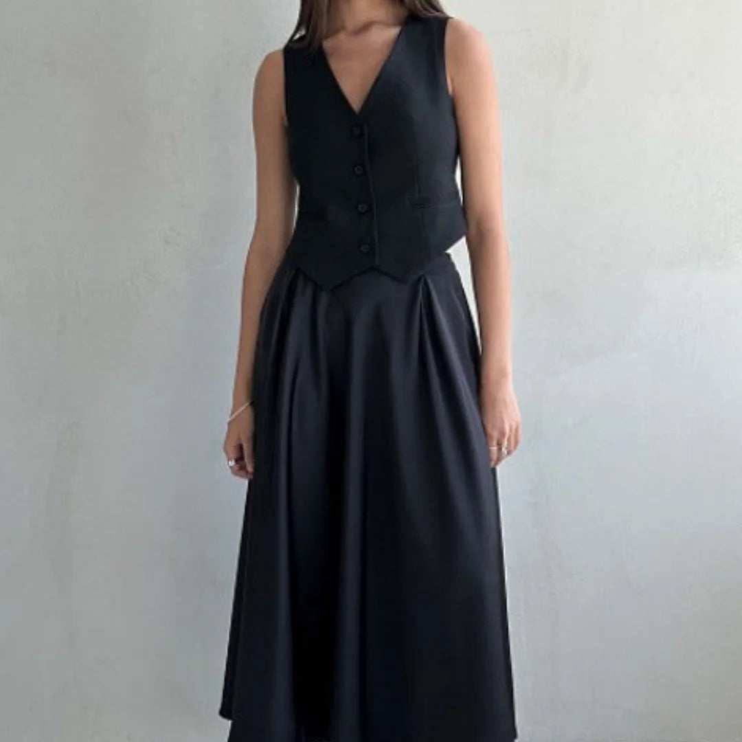 Black high-waist skirt for women by Khaza with a flowing design, made from comfortable and soft fabric.