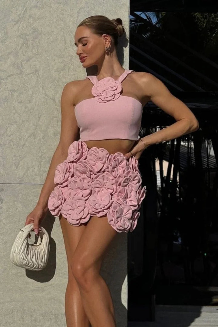 Pink halter top and shorts set with floral applique, perfect for warm days. Made of lightweight and comfy fabric for a…