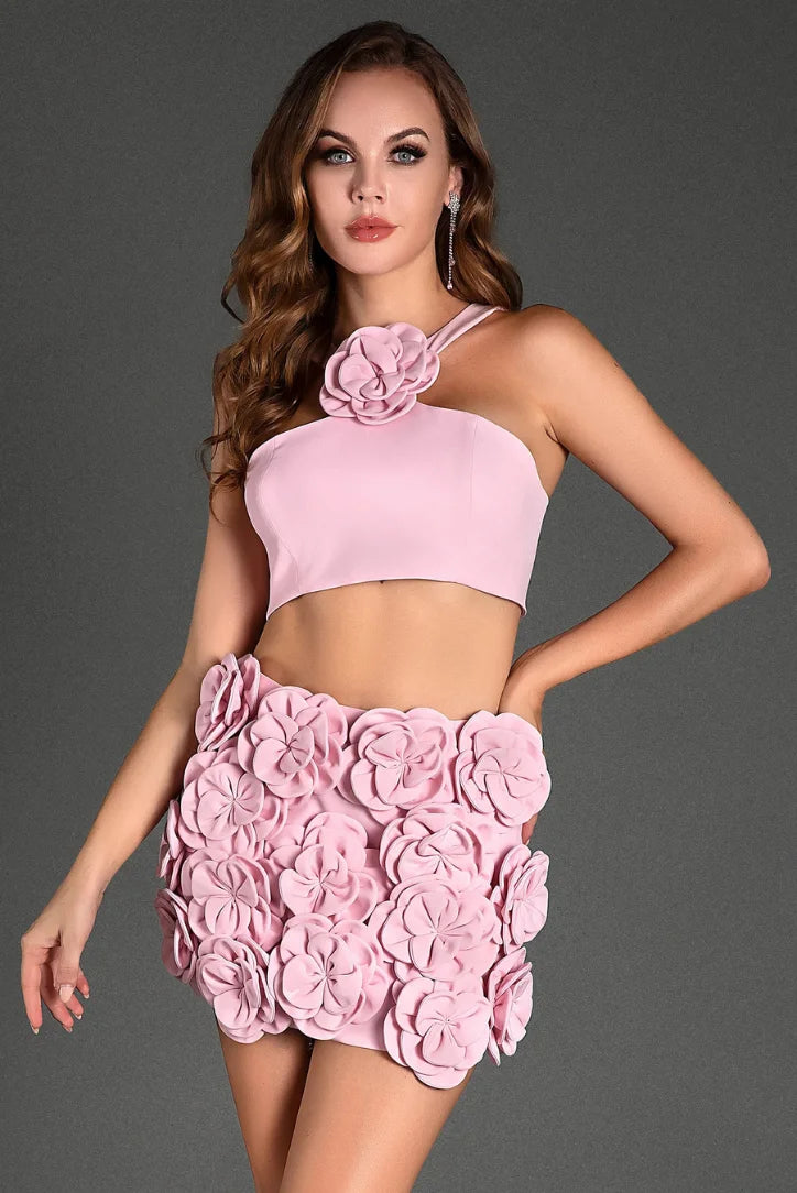 Pink halter top and shorts set with floral applique detailing, perfect for a chic and trendy summer look.