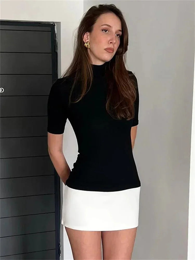 Navy and white mini dress with a turtleneck design, made of comfortable and stretchy fabric.