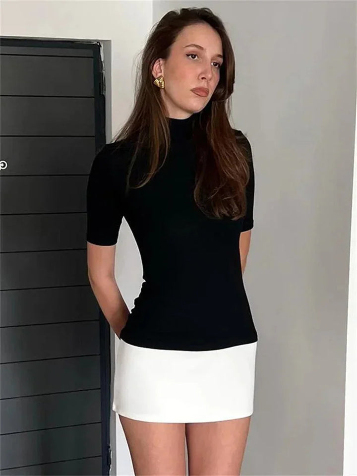 Navy and white mini dress with a turtleneck design, made of comfortable and stretchy fabric.
