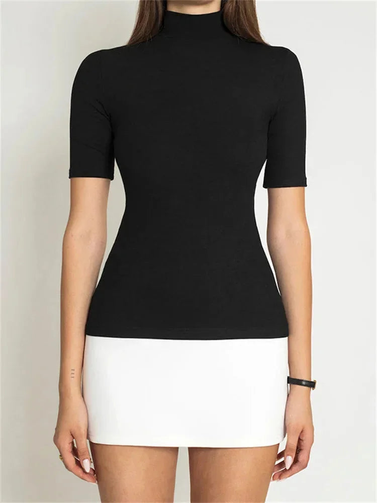 Navy and white mini dress featuring a classic turtleneck design, made with comfortable and stretchy fabric.