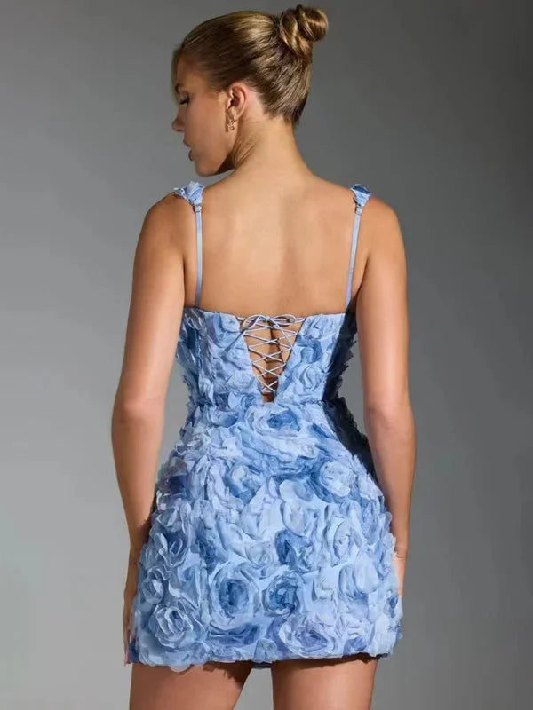 Floral textured mini dress with straps featuring a feminine design in a lightweight and comfortable material.