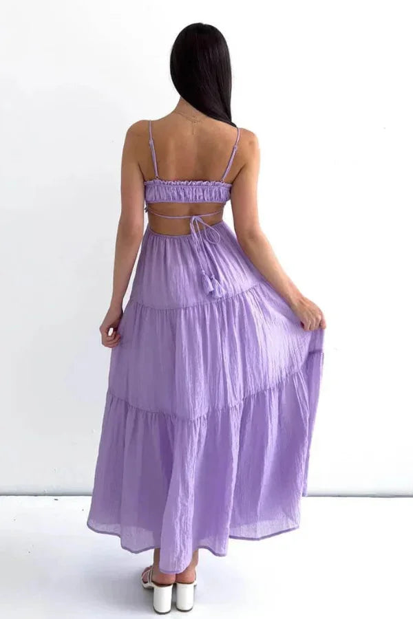 Tiered maxi dress made of flowy fabric with an elegant design named Klara, perfect for a stylish woman's wardrobe.