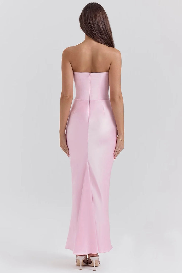 Pink strapless silk maxi dress in flowing style with a subtle sheen, perfect for any elegant occasion.