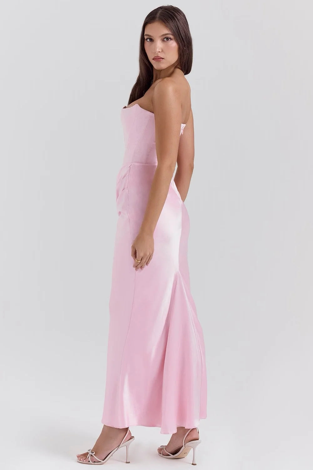 Strapless pink silk maxi dress with a flowing design, perfect for special occasions or elegant evenings.