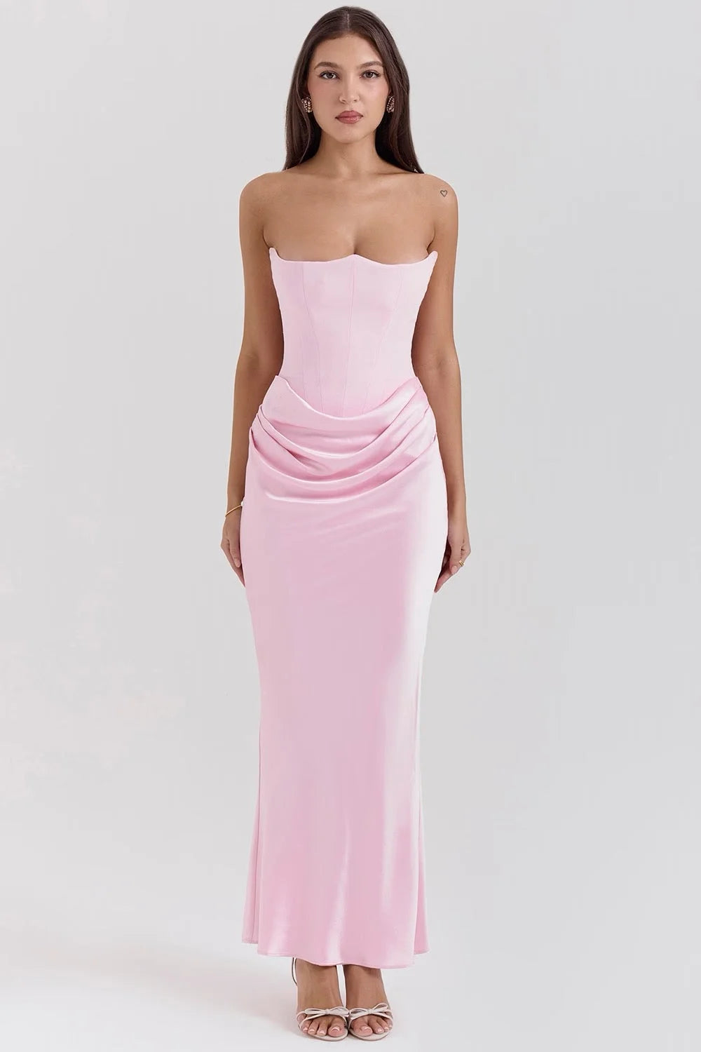 Baby pink silk strapless maxi dress with a flowy design, perfect for a sophisticated and elegant look on special occasions.
