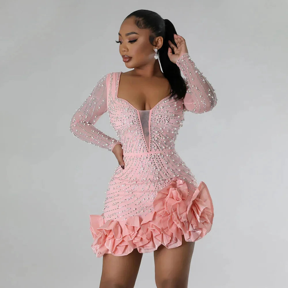 Pink mini dress with ruffles and embellishments by Klover. Perfect for a feminine and stylish look, made with high-quality…