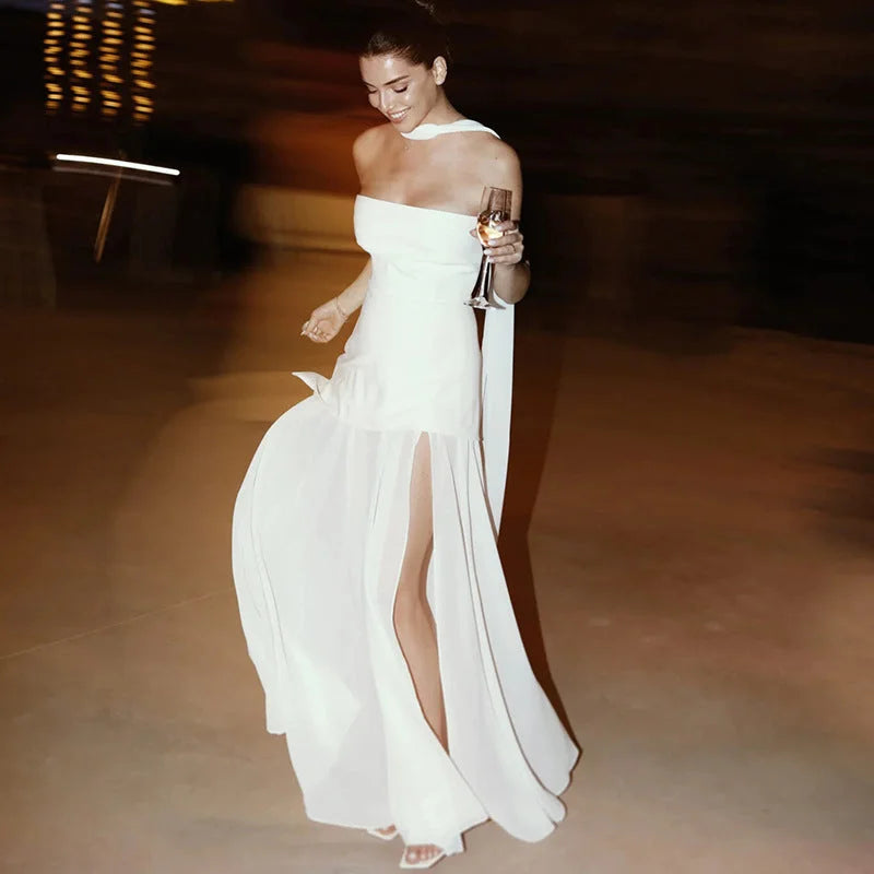 Asymmetrical layered maxi dress in soft cotton blend with a contemporary cut and elegant drape.