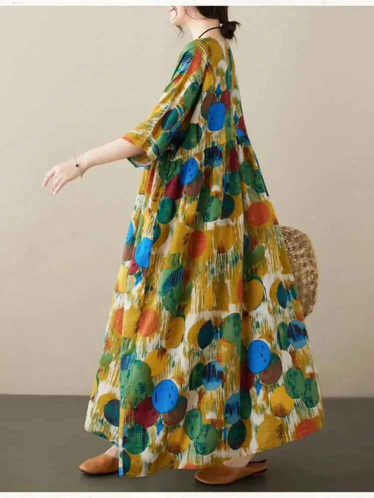 "Flowing boho maxi dress with artistic prints in soft cotton blend, perfect for a relaxed and stylish summer look."